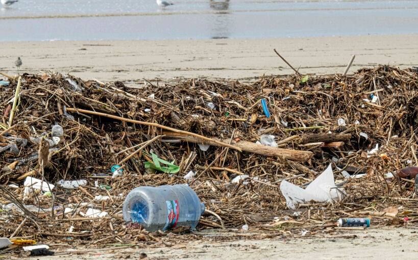 HUNTINGTON BEACH, CA - FEBRUARY 27: The pile of trash and debris on the beach that washed down the Santa Ana River in Huntington Beach on Monday, February 27, 2023 after the recent rain storms that hit Southern California. (Photo by Leonard Ortiz/MediaNews Group/Orange County Register via Getty Images)