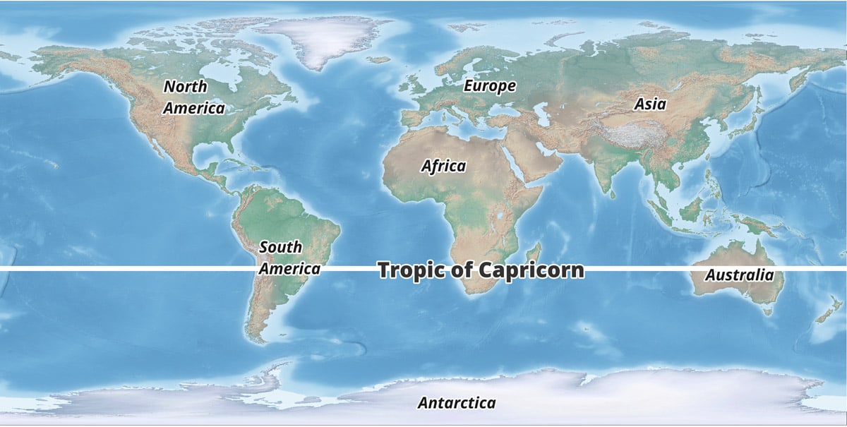 A shaded relief map of the world with a bold white line marking the Tropic of Capricorn.